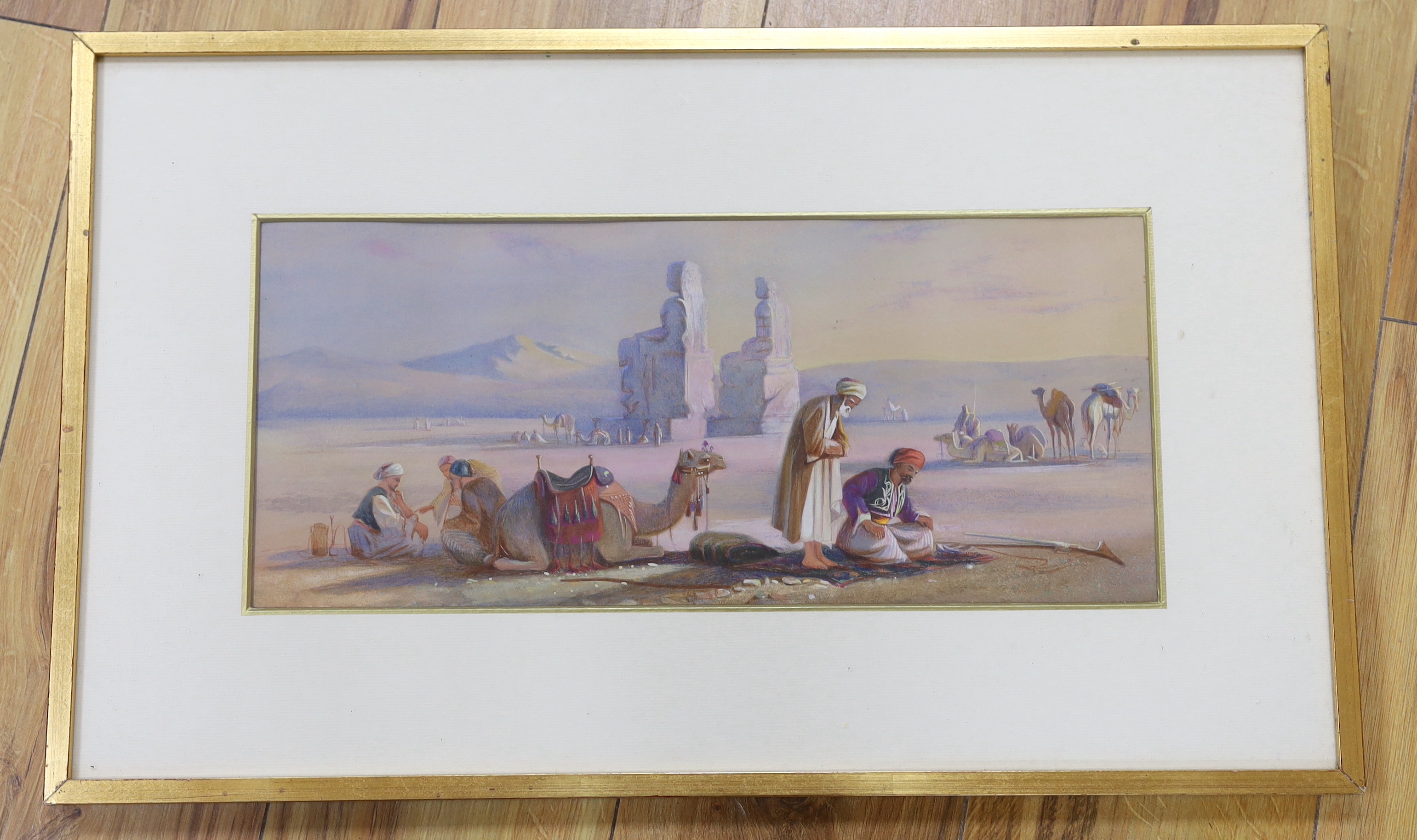 Orientalist style, pastel and watercolour, Egyptian landscape with camels and figures, 42 x 18cm